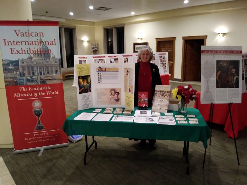 exhibit greeter and brochure table